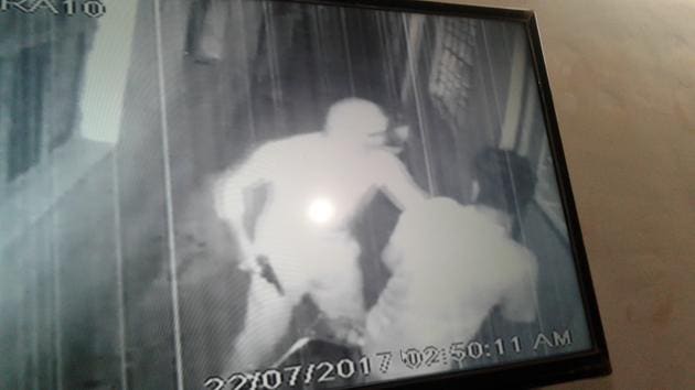 A CCTV grab showing one of the gang members roughing up a crusher employee. (CCTV imgage) A CCTV grab showing one of the gang members roughing up a crusher employee. (CCTV imgage)