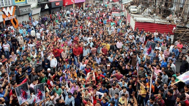 People protest during the ‘Shimla Bandh’ and demand justice for teenage school girl who was raped and murder at Kotkhai, in Shimla on Thursday. (PTI Photo) People protest during the ‘Shimla Bandh’ and demand justice for teenage school girl who was raped and murder at Kotkhai, in Shimla on Thursday. (PTI Photo)