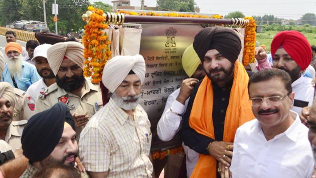 Local bodies minister Navjot Singh Sidhu during the inauguration of a railway overbridge in Amritsar on Friday. (Sameer Sehgal/HT) Local bodies minister Navjot Singh Sidhu during the inauguration of a railway overbridge in Amritsar on Friday. (Sameer Sehgal/HT)