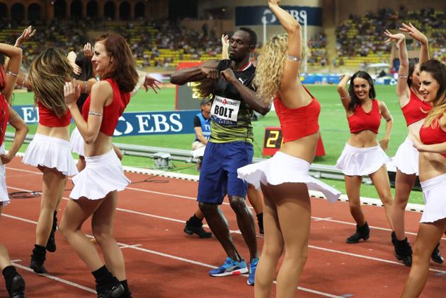 This is because Usain Bolt then proceeded to dance with the pom-pom girls. (AFP) This is because Usain Bolt then proceeded to dance with the pom-pom girls. (AFP)