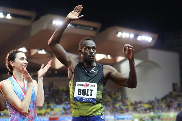 Usain Bolt acknowledges the crowd before receiving his gold medal. (AFP) Usain Bolt acknowledges the crowd before receiving his gold medal. (AFP)