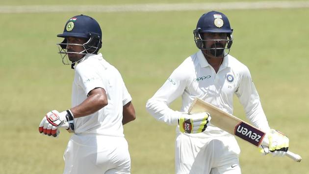 Wriddhiman Saha (L) spent some quality time in the middle courtesy an unbeaten 36-run knock. (AFP) Wriddhiman Saha (L) spent some quality time in the middle courtesy an unbeaten 36-run knock. (AFP)