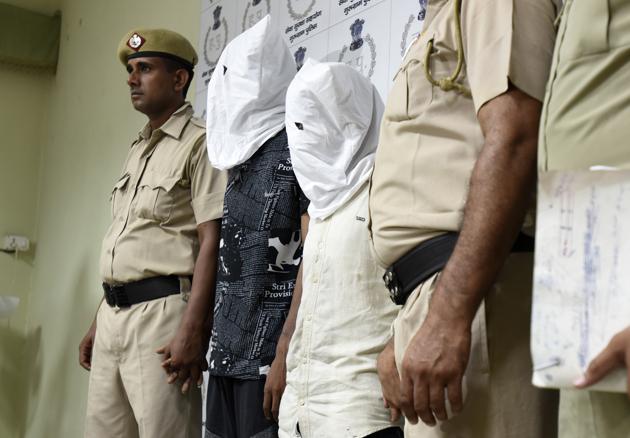 The gang members paraded by the police after their arrest. (Sanjeev Verma/HT PHOTO) The gang members paraded by the police after their arrest. (Sanjeev Verma/HT PHOTO)