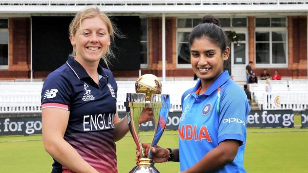 India skipper Mithali Raj and England skipper Heather Knight pose with the ICC Women’s World Cup trophy ahead of the final at Lord’s. (PTI)