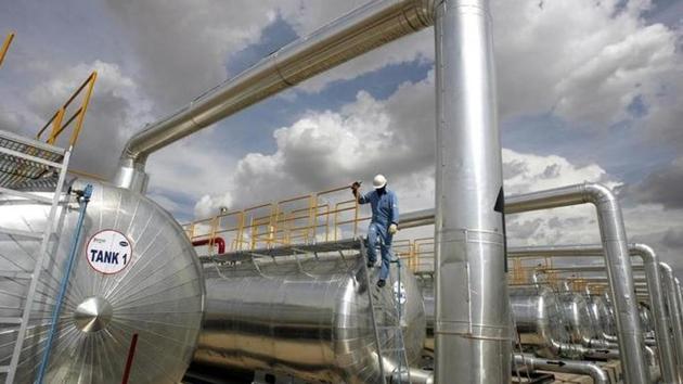 A Cairn India employee works at a storage facility for crude oil at Mangala oil field at Barmer in Rajasthan.(REUTERS) A Cairn India employee works at a storage facility for crude oil at Mangala oil field at Barmer in Rajasthan.(REUTERS)