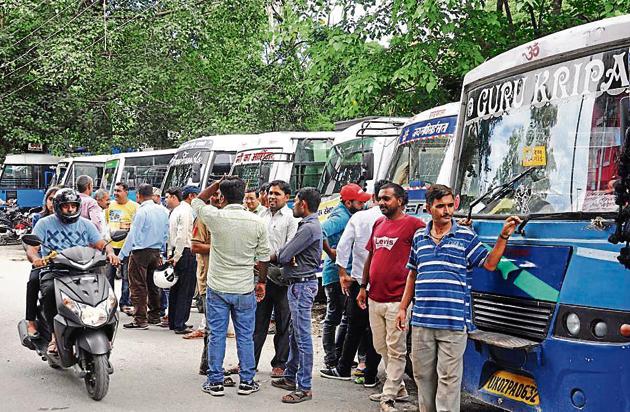 City buses stationed at the regional transport office during strike in Dehradun. (HT Photo)