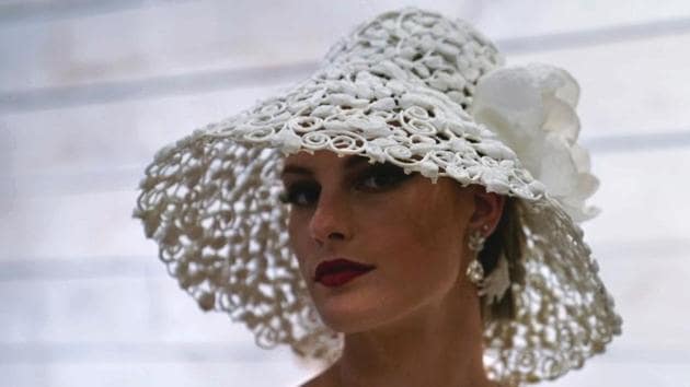 A model is pictured backstage wearing a wedding dress accompanied by a hat made out of toilet paper before a fashion show.(Carlo Allegri / REUTERS) A model is pictured backstage wearing a wedding dress accompanied by a hat made out of toilet paper before a fashion show.(Carlo Allegri / REUTERS)