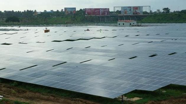 Solar panels laid across a field. (Wikimedia Commons/Binu Jayakrishnan) Solar panels laid across a field. (Wikimedia Commons/Binu Jayakrishnan)
