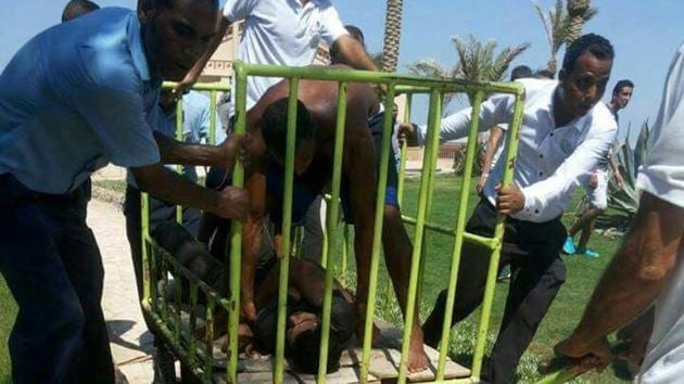 Workers and security detain the man accused of stabbing two German tourists to death and wounding four others during an attack of the Zahabia hotel resort in Hurghada, south of the capital Cairo, Egypt. (Mohamed Aly / REUTERS) Workers and security detain the man accused of stabbing two German tourists to death and wounding four others during an attack of the Zahabia hotel resort in Hurghada, south of the capital Cairo, Egypt. (Mohamed Aly / REUTERS)