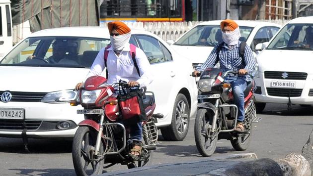 Ludhiana police on Saturday registered 41 cases against those riding two wheelers with their faces covered. (Gurminder Singh/HT) Ludhiana police on Saturday registered 41 cases against those riding two wheelers with their faces covered. (Gurminder Singh/HT)