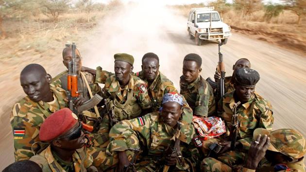 South Sudan's army, or the SPLA, soldiers drive in a truck on the frontline in Panakuach, Unity state . (Goran Tomasevic / REUTERS) South Sudan's army, or the SPLA, soldiers drive in a truck on the frontline in Panakuach, Unity state . (Goran Tomasevic / REUTERS)