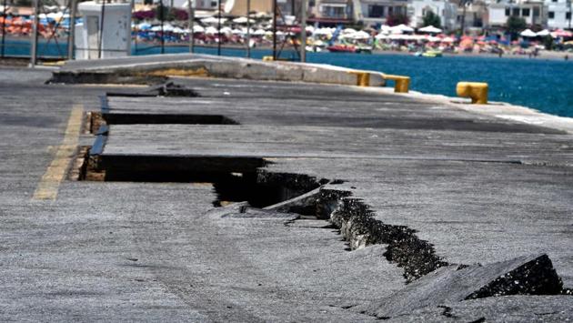 Cracks are seen at the main port on the island of Kos on July 21, 2017, following a 6.5 magnitude earthquake which struck the region. Two foreigners died and more than 100 people were injured on the Greek island of Kos when an earthquake shook popular Greek and Turkish holiday destinations in the Aegean Sea. The epicentre of the 6.7 magnitude quake was some 10.3 kilometres (6.4 miles) south of the major Turkish resort of Bodrum, a magnet for holidaymakers in the summer, and 16.2 kilometres east of the island of Kos in Greece, the US Geological Survey said. (LOUISA GOULIAMAKI / AFP) Cracks are seen at the main port on the island of Kos on July 21, 2017, following a 6.5 magnitude earthquake which struck the region. Two foreigners died and more than 100 people were injured on the Greek island of Kos when an earthquake shook popular Greek and Turkish holiday destinations in the Aegean Sea. The epicentre of the 6.7 magnitude quake was some 10.3 kilometres (6.4 miles) south of the major Turkish resort of Bodrum, a magnet for holidaymakers in the summer, and 16.2 kilometres east of the island of Kos in Greece, the US Geological Survey said. (LOUISA GOULIAMAKI / AFP)
