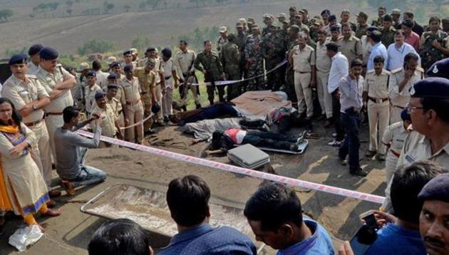 Police officers and Special Task Force soldiers stand beside bodies of the eight suspected SIMI operatives who escaped the high security jail in Bhopal on October 31, 2016. The men were killed in an encounter at the Acharpura village on the outskirts of Bhopal. (Reuters file) Police officers and Special Task Force soldiers stand beside bodies of the eight suspected SIMI operatives who escaped the high security jail in Bhopal on October 31, 2016. The men were killed in an encounter at the Acharpura village on the outskirts of Bhopal. (Reuters file)