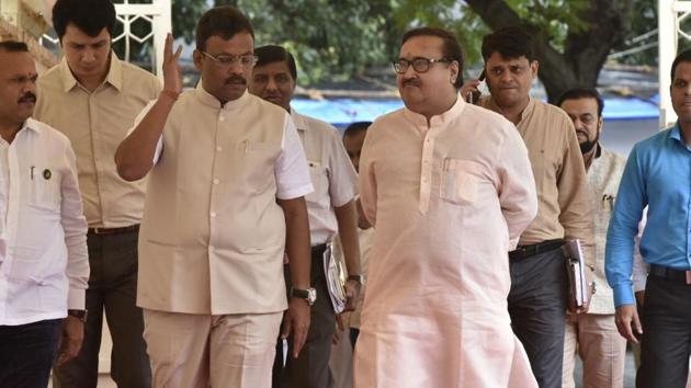 State education minister Vinod Tawde and housing minister Prakash Mehta make an entry. (anshuman poyrekar/ht photo) State education minister Vinod Tawde and housing minister Prakash Mehta make an entry. (anshuman poyrekar/ht photo)