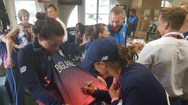 England players sign jerseys in the dressing room after the win. (ICC FACEBOOK) England players sign jerseys in the dressing room after the win. (ICC FACEBOOK)
