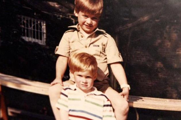 Prince William and Prince Harry on a picnic bench in a snap from a family album. (Kensington Palace/Handout via REUTERS )