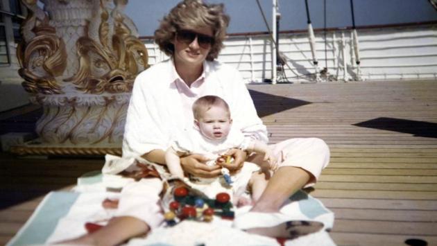 Diana, Princess of Wales, holds Prince Harry on the Royal Yacht Britannia in a snap taken by Prince William. (Kensington Palace/Handout via REUTERS )