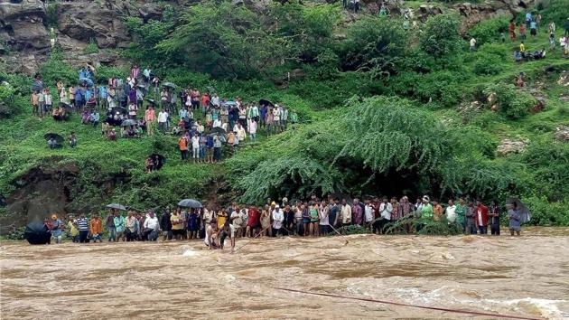 Rescue work is carried out after a jeep was swept away by floods in Kherwada area of Udaipur district on Monday. (PTI) Rescue work is carried out after a jeep was swept away by floods in Kherwada area of Udaipur district on Monday. (PTI)