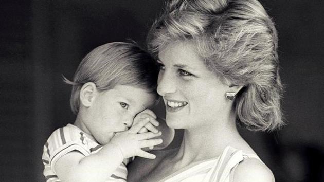 Britain's Princess Diana holds Prince Harry during a morning picture session at Marivent Palace, where the Prince and Princess of Wales are holidaying as guests of King Juan Carlos and Queen Sofia, in Mallorca, Spain August 9, 1988. Never before seen images of Diana, Princess of Wales with princes William and young Prince Harry were revealed for the first time ahead of the 20th anniversary of her death. (Reuters )