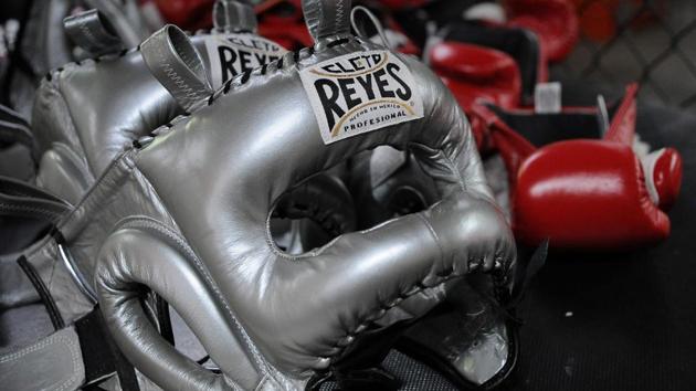 Protective training headgear and boxing gloves are pictured at Reyes Industries headquarters in Mexico City. (Bernardo Montoya / AFP) Protective training headgear and boxing gloves are pictured at Reyes Industries headquarters in Mexico City. (Bernardo Montoya / AFP)