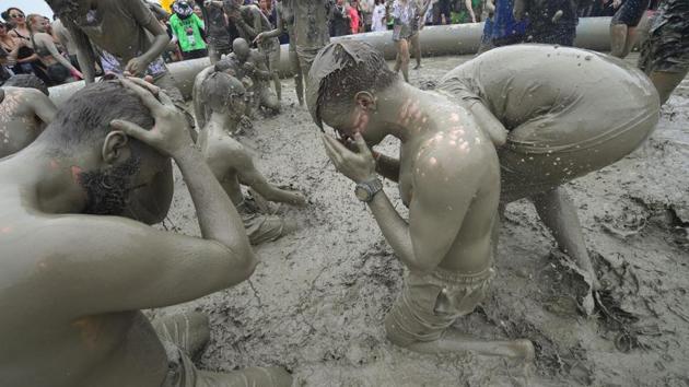 In 2009 a group of 230 school children developed a skin rash after contact with the mud, sparking concern from health officials. Despite the backlash, the festival continues and has been chosen the ultimate destination for those enjoying their summer in South Korea.  (JUNG Yeon-Je / AFP) 
