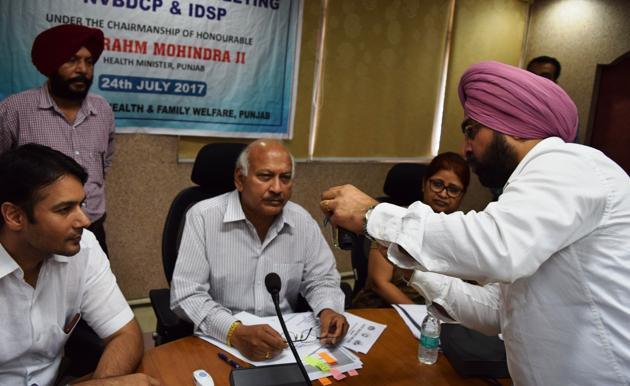 Punjab health minister Brahm mohindra interacting with officials of various departments during a meeting of teh state task force in Chandigarh on Monday. (HT Photo) Punjab health minister Brahm mohindra interacting with officials of various departments during a meeting of teh state task force in Chandigarh on Monday. (HT Photo)