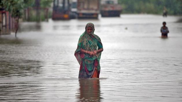 A woman walks through a flooded street in Ahmedabad, India. Incessant rain has thrown normal life out of gear in many parts Gujarat and several other parts of India. In Gujarat, 1,526 people in Banaskantha district, about 500 in Patan district, and over 200 at Kalol in Gandhinagar district have been shifted after floods to safer places. (Amit Dave / REUTERS) A woman walks through a flooded street in Ahmedabad, India. Incessant rain has thrown normal life out of gear in many parts Gujarat and several other parts of India. In Gujarat, 1,526 people in Banaskantha district, about 500 in Patan district, and over 200 at Kalol in Gandhinagar district have been shifted after floods to safer places. (Amit Dave / REUTERS)