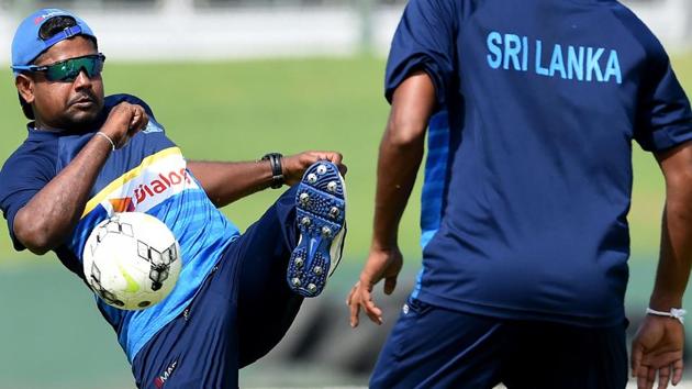 Sri Lanka cricket captain Rangana Herath (L) and Suranga Lakmal play football during a training session at Galle International Cricket Stadium on Tuesday. The first Test between SL and Indian cricket team will begin on Wednesday. (AFP) Sri Lanka cricket captain Rangana Herath (L) and Suranga Lakmal play football during a training session at Galle International Cricket Stadium on Tuesday. The first Test between SL and Indian cricket team will begin on Wednesday. (AFP)