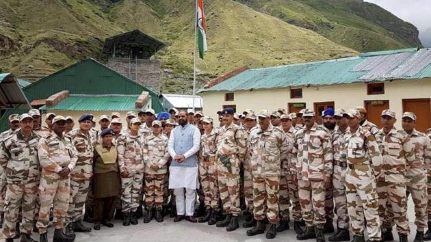 Minister of state for home affairs Hansraj Gangaram Ahir in a group photograph with the troopers during a visit to the ITBP Border Out Post (BOP), at Mana in Uttarakhand. (PTI File Photo)