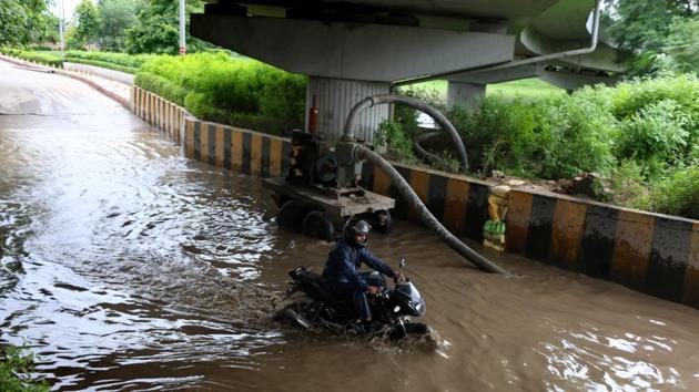 Waterlogging under the Mahamaya flyover on Saturday. (Salman Ali/HT Photo) Waterlogging under the Mahamaya flyover on Saturday. (Salman Ali/HT Photo)