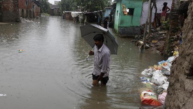 A man wades through flood waters at an area near River Sabarmati in Ahmadabad, India, Tuesday, July 25, 2017. The death toll in Gujarat has risen to 70 since the start of the monsoon season, which runs from June through September. (AP Photo) A man wades through flood waters at an area near River Sabarmati in Ahmadabad, India, Tuesday, July 25, 2017. The death toll in Gujarat has risen to 70 since the start of the monsoon season, which runs from June through September. (AP Photo)