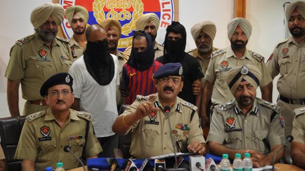 IGP Arpit Shukla and other police officials presenting the three arrested men in Jalandhar on Tuesday, July 25. (Pardeep Pandit/HT) IGP Arpit Shukla and other police officials presenting the three arrested men in Jalandhar on Tuesday, July 25. (Pardeep Pandit/HT)