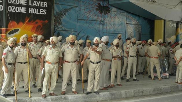 Police on security duty as memorial service of pastor Sultan Masih, who was shot dead outside a church recently, took place at a church in Salem Tabri, Ludhiana, on Monday, July 24.(HT Photo) Police on security duty as memorial service of pastor Sultan Masih, who was shot dead outside a church recently, took place at a church in Salem Tabri, Ludhiana, on Monday, July 24.(HT Photo)