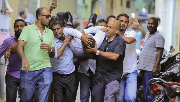 Maldivian lawmaker Faisal Naseem who was injured in clashes with police is rushed to a hospital in Male, Maldives on July 24. (AP Photo) Maldivian lawmaker Faisal Naseem who was injured in clashes with police is rushed to a hospital in Male, Maldives on July 24. (AP Photo)