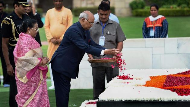 President-elect Ram Nath Kovind with his wife pays floral tributes to Mahatma Gandhi at Rajghat. (PTI) President-elect Ram Nath Kovind with his wife pays floral tributes to Mahatma Gandhi at Rajghat. (PTI)