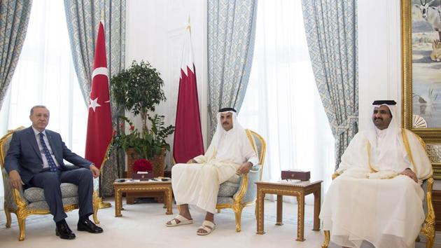 Turkish President Recep Tayyip Erdogan (L) attending a meeting with the Emir of Qatar Sheikh Tamim bin Hamad Al Thani (C) and Deputy Emir of Qatar Abdullah bin Hamad bin Khalifa Al Thani (R) in Doha at the start of his official visit to Qatar, as part of a Gulf tour aimed at defusing a dispute between Turkey's ally Qatar and a bloc of Saudi-led Arab states. (AFP Photo) Turkish President Recep Tayyip Erdogan (L) attending a meeting with the Emir of Qatar Sheikh Tamim bin Hamad Al Thani (C) and Deputy Emir of Qatar Abdullah bin Hamad bin Khalifa Al Thani (R) in Doha at the start of his official visit to Qatar, as part of a Gulf tour aimed at defusing a dispute between Turkey's ally Qatar and a bloc of Saudi-led Arab states. (AFP Photo)