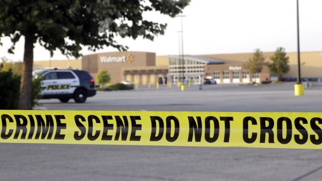 San Antonio police officers investigate the scene where eight people were found dead in a tractor-trailer loaded with at least 30 others outside a Walmart store on July 23. (AP Photo) San Antonio police officers investigate the scene where eight people were found dead in a tractor-trailer loaded with at least 30 others outside a Walmart store on July 23. (AP Photo)