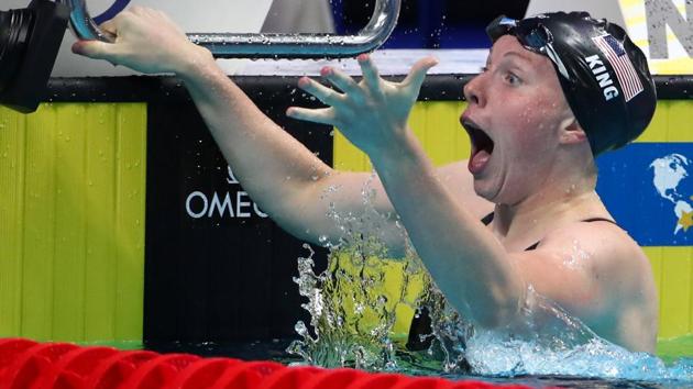 Lilly King of the US reacts after winning the race and breaking the world record in women’s 100 metres breaststroke in the world swimming championships in Budapest on Tuesday.(REUTERS)