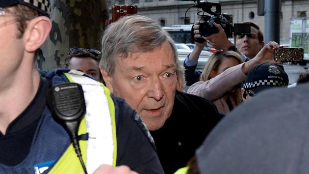 Vatican finance chief Cardinal George Pell (C) arrives under heavy police protection for a hearing at the Melbourne Magistrates Court in Melbourne. (AFP Photo) Vatican finance chief Cardinal George Pell (C) arrives under heavy police protection for a hearing at the Melbourne Magistrates Court in Melbourne. (AFP Photo)