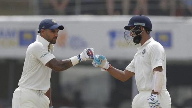 Powered by centuries from Cheteshwar Pujara (R) and Shikhar Dhawan, India reached 399/3 on Day 1 of the first Test Sri Lanka at Galle on Wednesday. (AP) Powered by centuries from Cheteshwar Pujara (R) and Shikhar Dhawan, India reached 399/3 on Day 1 of the first Test Sri Lanka at Galle on Wednesday. (AP)