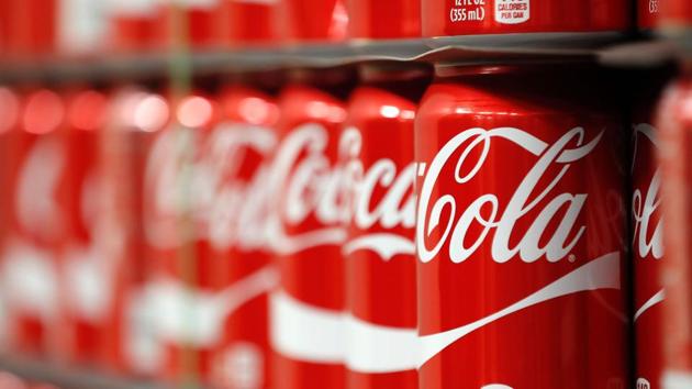 The company says the new cans and bottles, which will incorporate more red like regular Coke, will start hitting shelves in August.(AFP File)