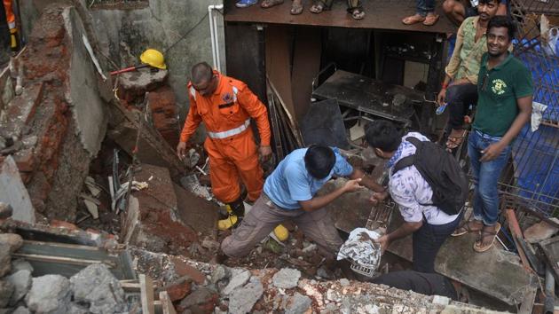 NDRF and fire brigade teams rescue those stuck in the rubble. (PRASHANT WAYDANDE) NDRF and fire brigade teams rescue those stuck in the rubble. (PRASHANT WAYDANDE)