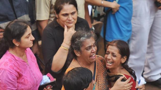 Rita Doshi (in brown) panicked after the building collapse. Her husband Rajesh was rescued on Wednesday morning.(Satyabrata Tripathy/HT Photo)