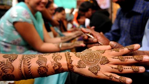 Henna being applied on the hands of women in during Teej festival in Patiala on Wednesday. (Bharat Bhushan/HT Photo) Henna being applied on the hands of women in during Teej festival in Patiala on Wednesday. (Bharat Bhushan/HT Photo)