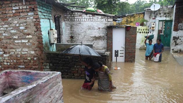 Indian residents wade through flood waters in a low-lying area near the Sabarmati River in Ahmedabad on July 25. (AFP Photo) Indian residents wade through flood waters in a low-lying area near the Sabarmati River in Ahmedabad on July 25. (AFP Photo)