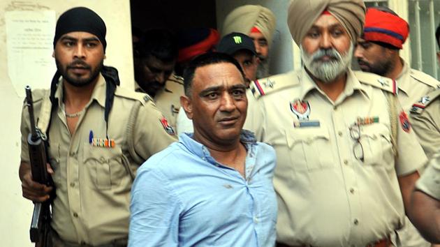 Raja Kandola in police custody at the Jalandhar courts after a hearing. (HT File Photo) Raja Kandola in police custody at the Jalandhar courts after a hearing. (HT File Photo)