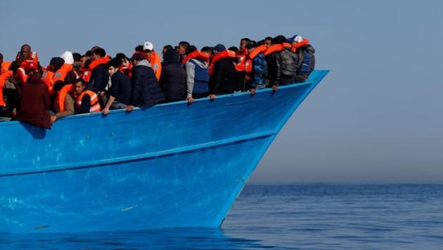 Migrants on a wooden boat await in the central Mediterranean in international waters off the coast of Sabratha in Libya, April 15, 2017. (Reuters File Photo) Migrants on a wooden boat await in the central Mediterranean in international waters off the coast of Sabratha in Libya, April 15, 2017. (Reuters File Photo)