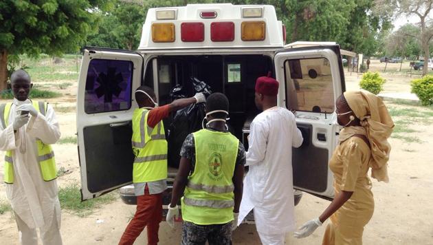 Rescue workers load the body of a victim into an ambulance following a suicide attack at the University, in Maiduguri, Nigeria, Monday, July. 24, 2017. Female suicide bombers attacked two camps for displaced people in northeastern Nigeria's main city, leaving many dead and injured. (AP) Rescue workers load the body of a victim into an ambulance following a suicide attack at the University, in Maiduguri, Nigeria, Monday, July. 24, 2017. Female suicide bombers attacked two camps for displaced people in northeastern Nigeria's main city, leaving many dead and injured. (AP)
