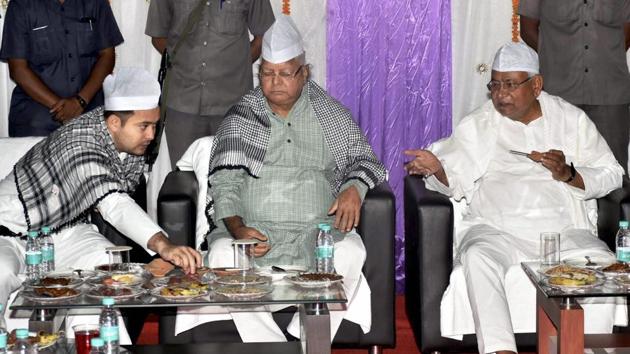 Bihar chief minister Nitish Kumar with RJD chief Lalu Prasad and deputy CM Tejashwi Yadav during a Roza-Iftaar party in Patna on June 19, 2017.(PTI File Photo)