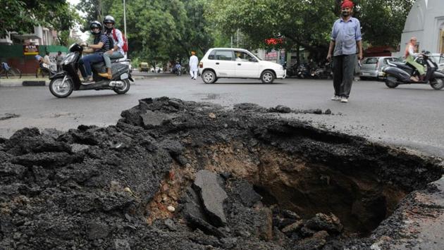 A part of road caved in sector 46, Chandigarh, after heavy rains lashed the region on Thursday. (Keshav Singh/HT Photo) A part of road caved in sector 46, Chandigarh, after heavy rains lashed the region on Thursday. (Keshav Singh/HT Photo)